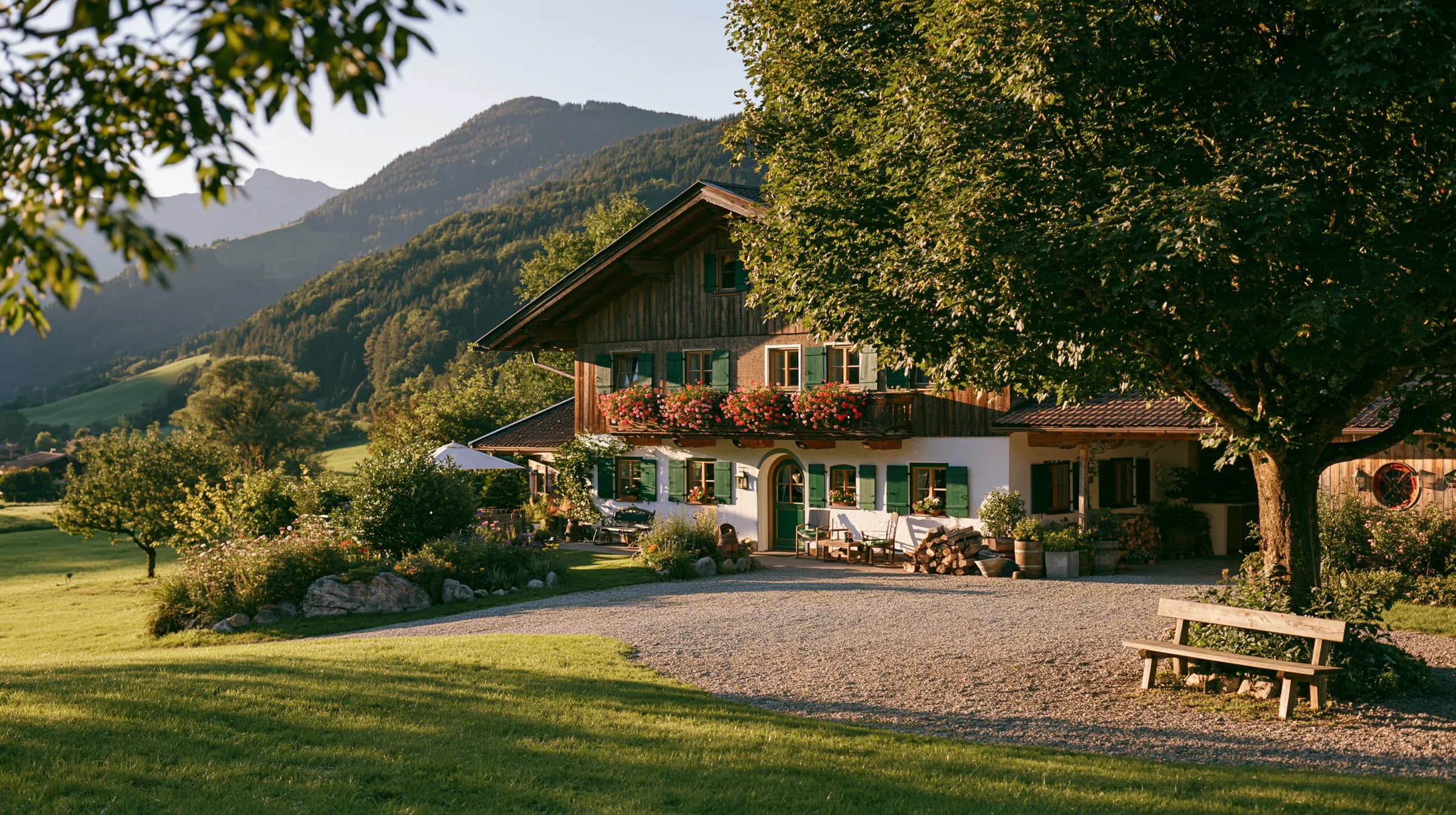 Gasthof zur grünen Weide in the evening light, with a meadow and a chestnut tree in front
